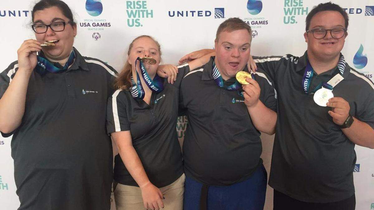 Max Wolff (far right) won a gold and silver medal in swimming at the Special Olympics USA Games.