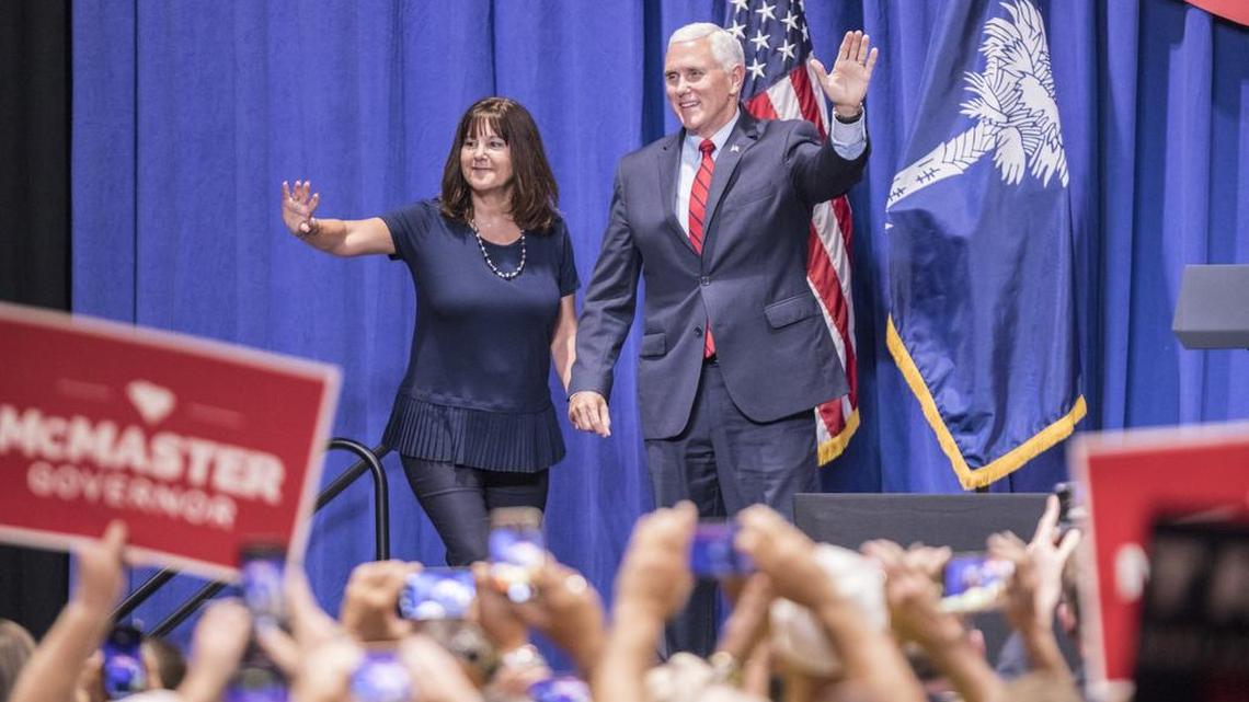 Vice President Mike Pence walks onto the stage with the second lady Karen Pence during a visit to Coastal Carolina University to campaign for incumbent Gov. Henry McMaster on Saturday in Conway, SC. McMaster is facing a runoff against John Warren on Tuesday, and the Trump administration is supporting the incumbent candidate. June 23, 2018.
