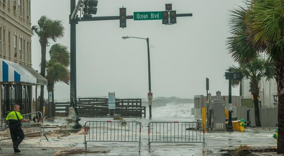 Hurricane Matthew's waters covered the 3rd Ave S area of Myrtle Beach as barricades went up.