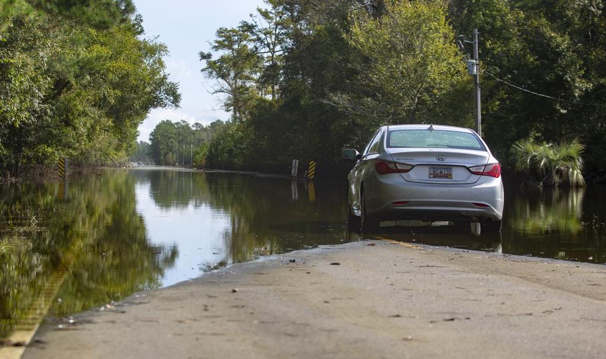 In this file photo, a car sits abandoned in the middle of Hwy. 905 in Longs in Horry County in September 2018 following Hurricane Florence.