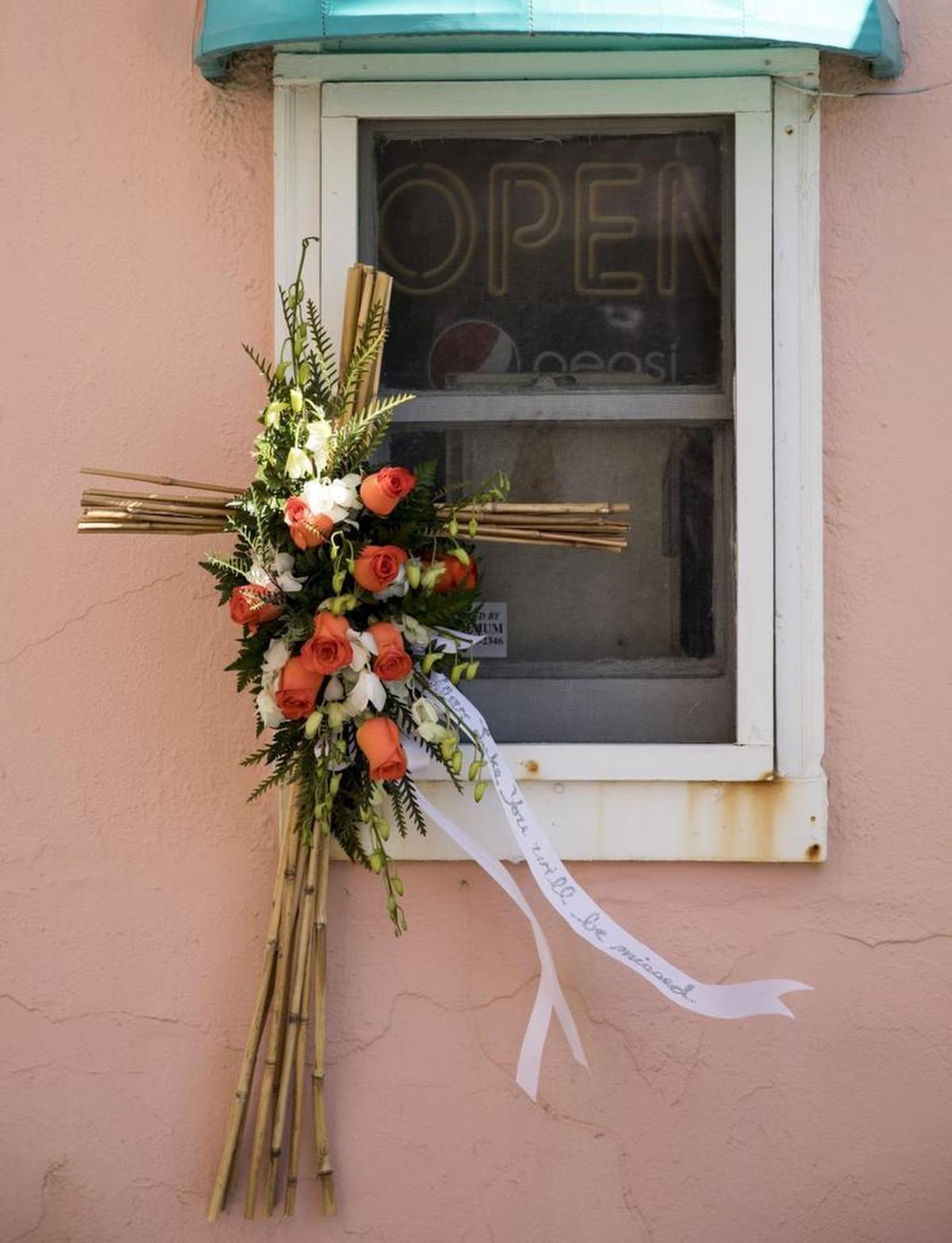 A cross made of bamboo stalks hangs from the window at the St. Clements Beach Bar and Grill in honor of Luke Goude. Goude, a well known member of the Myrtle Beach community and owner of St. Clements Beach Bar and Grill died in his home on Tuesday.