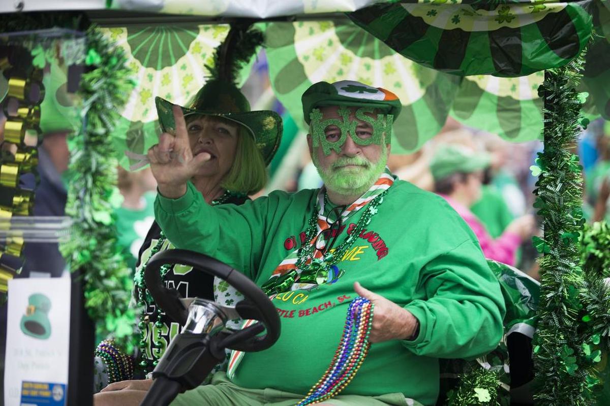 Parade revelers deck out in green Saturday during the St. Patricks Day Parade in North Myrtle Beach.