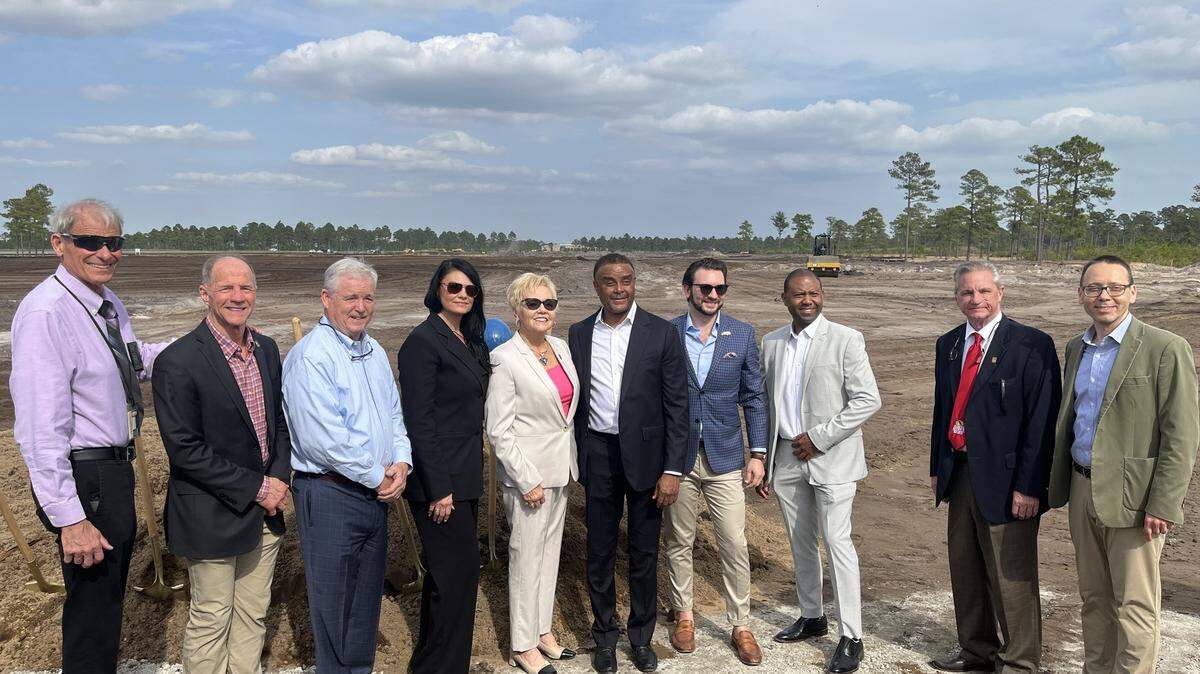 North Myrtle Beach city manager Mike Mahaney, far left, stands with members of the city council at a Feb. 24, 2023 groundbreaking inside the Palmetto State Industrial Park. A body camera was affixed to Mahaney’s shirt during the event.