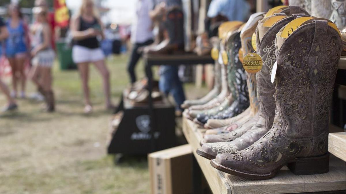 Cowboy boots sit on display at the Carolina Country Music Festival in Myrtle Beach, S.C. on June 8, 2018.