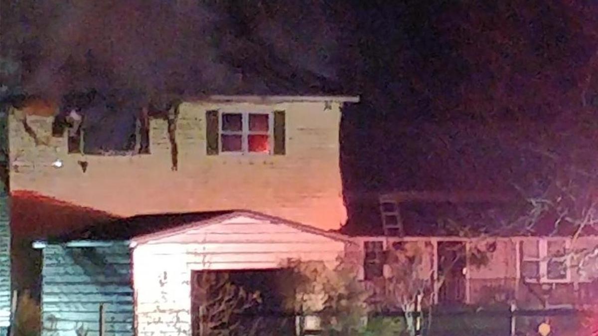 Horry County Fire Rescue personnel work a fire in a single-family home in Aynor.