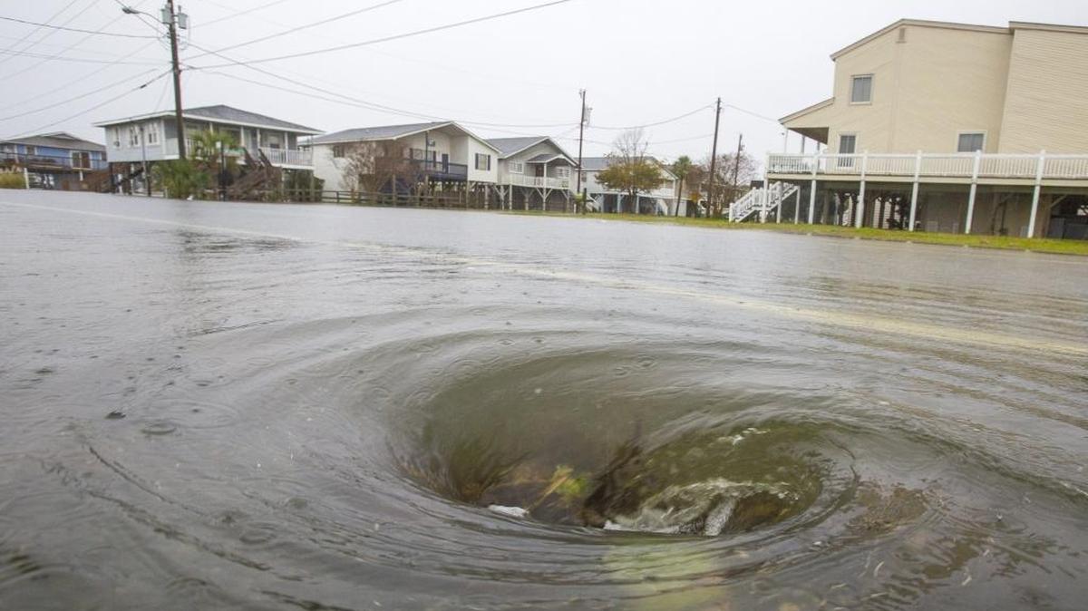 A whirlpool is created where floodwaters drain on Duffy Street in North Myrtle Beach. Flooding from “King Tides” and historically heavy rains have North Myrtle Beach leaders considering stormwater management fee increases to fund ocean outfall and stormwater management projects.