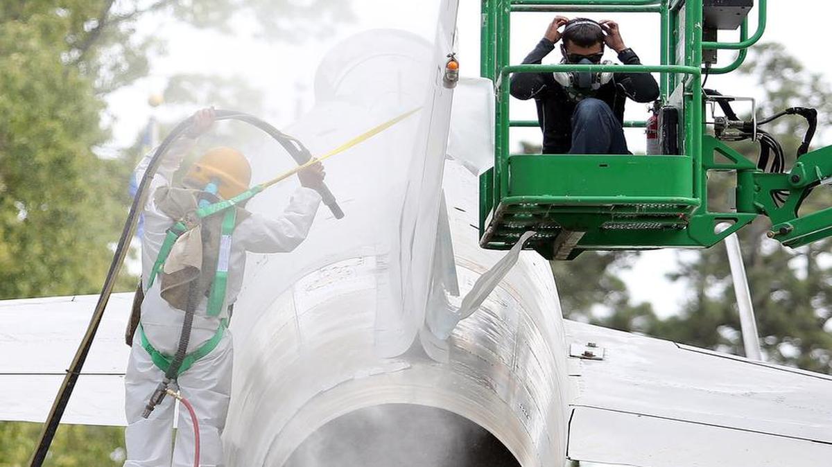 Sandblasting and painting is done on the F-100 Super Sabre at Warbird Park in Myrtle Beach on Tuesday, April 19, 2016. The park on Farrow Parkway may be closed for a few days in coming weeks as the airplanes there are painted or touched-up. The silver F-100 Super Sabre will be completely repainted, while the A-7 and the A-10 Warthog will get touch-ups. The planes are on permanent loan from the U.S. Air Force and must be maintained to Air Force standards.