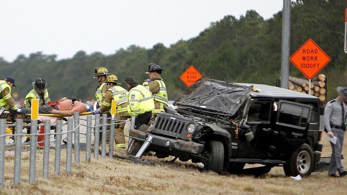 A man is taken to an ambulance after being extracted from his Jeep in the S.C. 31 median near S.C. 544 on Friday, Feb. 12, 2016. The Jeep rolled over a few times. He does not have life threatening injuries, according to an Horry County firefighter. The man had a dog in the Jeep with him at the time of the roll over and the dog is fine.