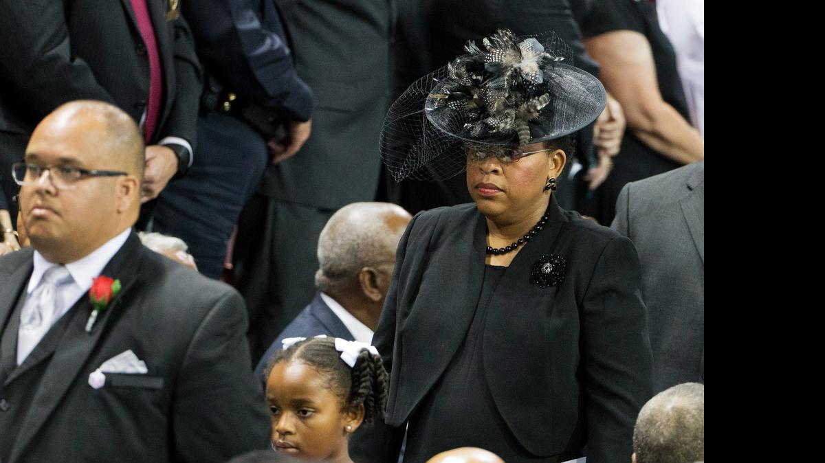 
Sen. Clementa Pinckney's wife Jennifer Pinckney, right, and daughter Malana walk in for his funeral service, Friday, June 26, 2015, in Charleston, S.C. President Barack Obama will deliver the eulogy at Pinckney's funeral Friday at College of Charleston's TD Arena near the Emanuel AME Church, the scene of last week's shooting. 
