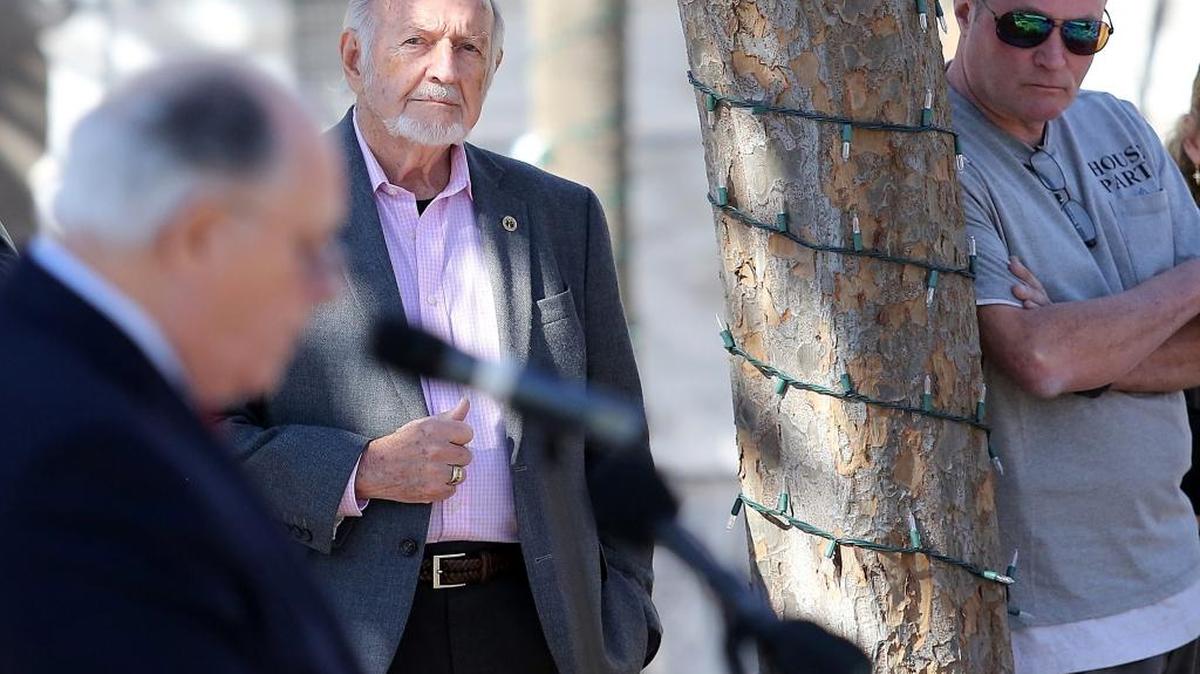 Jack Thompson (center) and Andrew Paulussen (right) listen as Myrtle Beach Mayor John Rhodes announces the city plans to buy most of the superblock and build a library and a branch of the South Carolina Children's Museum. The announcement was made on Tuesday, Jan. 24, 2017, in Nance Plaza. Thompson’s Gallery space, which he rents, and Paulussen’s home wares store are the only two properties that the city has not already purchase for its project.