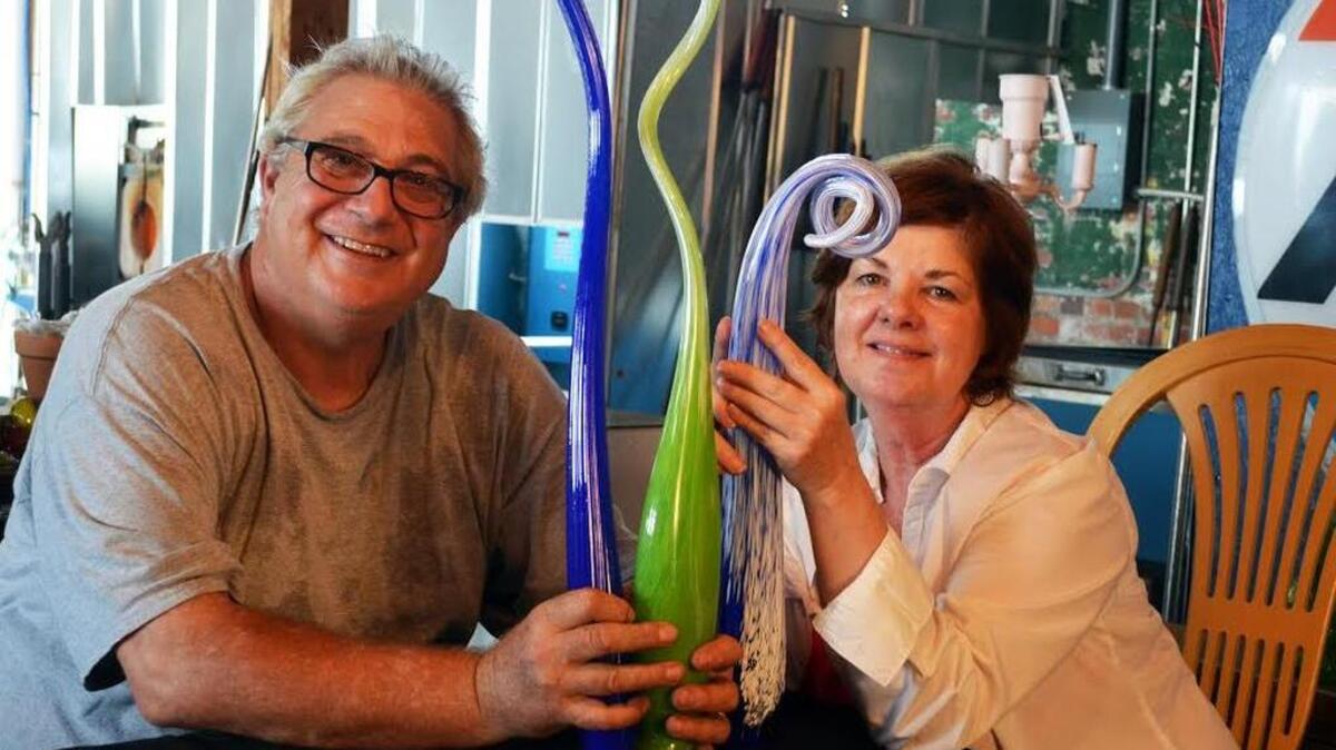 Ed and Barbara Streeter of Conway Glass Inc. sit beside some of their commissioned glass works for Anne’s Garden at Brookgreen Gardens, which will open the 16th annual “Nights of a Thousand Candles” on Thursday for three weekends.
