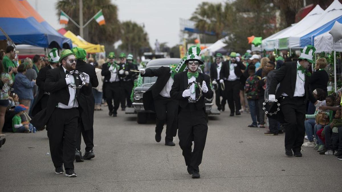 The Omar Jazz Morticians dance down Main Street Saturday during the St. Patricks Day Parade in North Myrtle Beach.