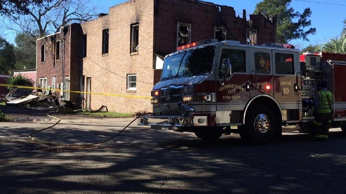 An apartment building in Georgetown caught fire early Tuesday morning and left three occupants injured.