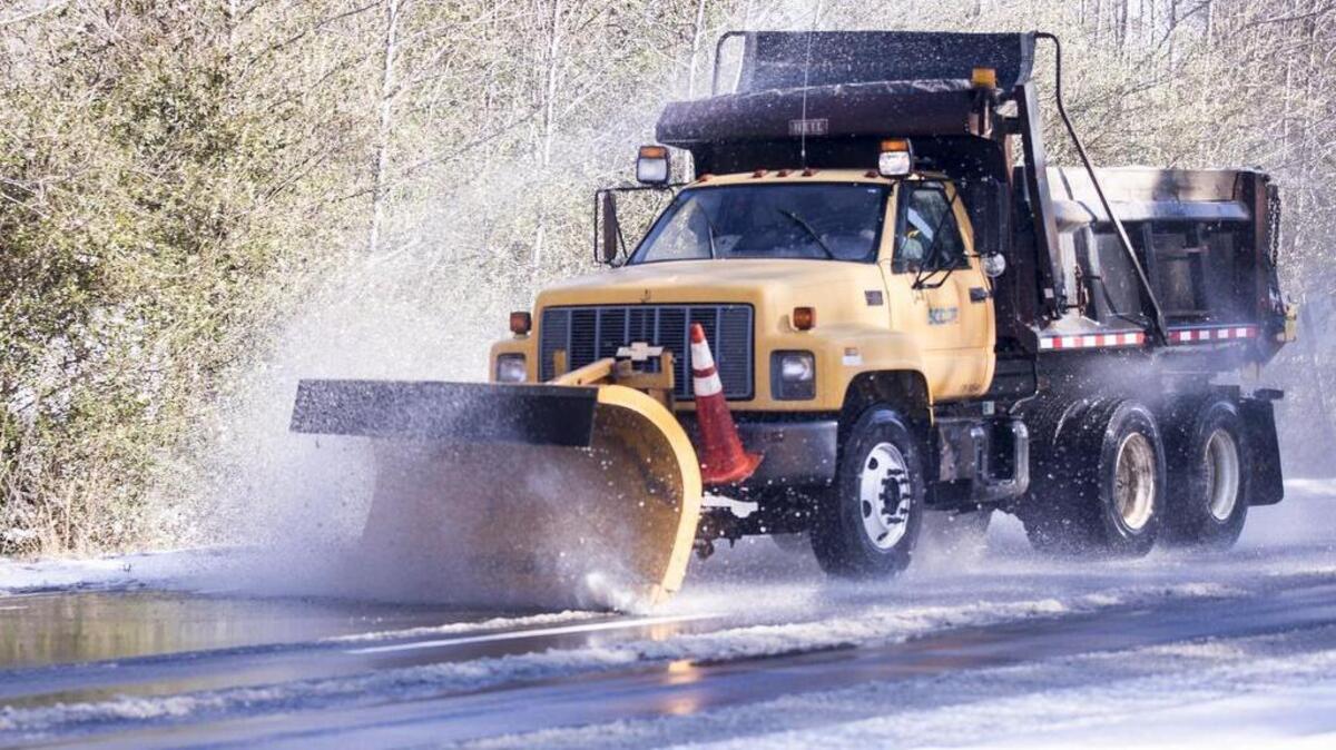 A South Carolina Department of Transportation snow plow clears U.S. Highway 501 near Gallivants Ferry on Thursday. The Grand Strand missed out on the heaviest snows from Winter Storm Grayson, but area roads were solid sheets of ice on Thursday morning Thursday. Jan. 4, 2018.