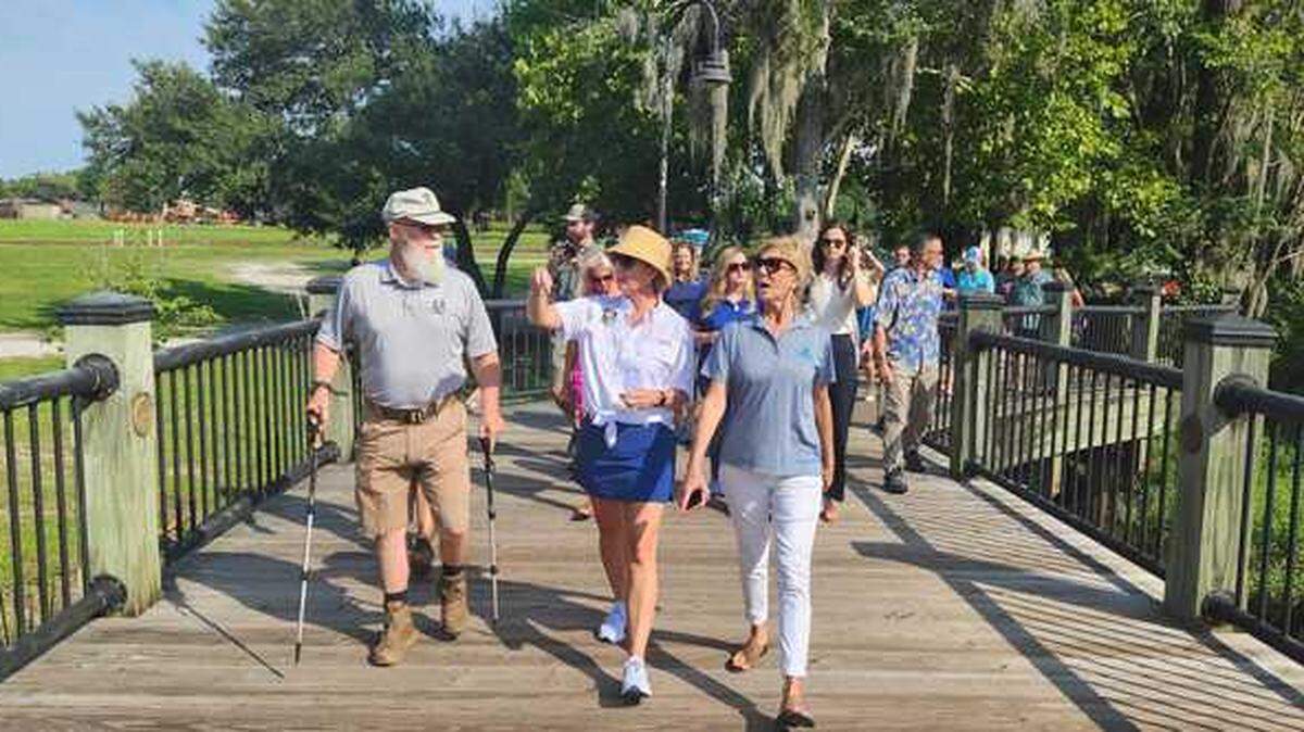 Lt. Gov. Pamela Evette, center, chats with hikers along the Conway Riverwalk on July 17, 2023.