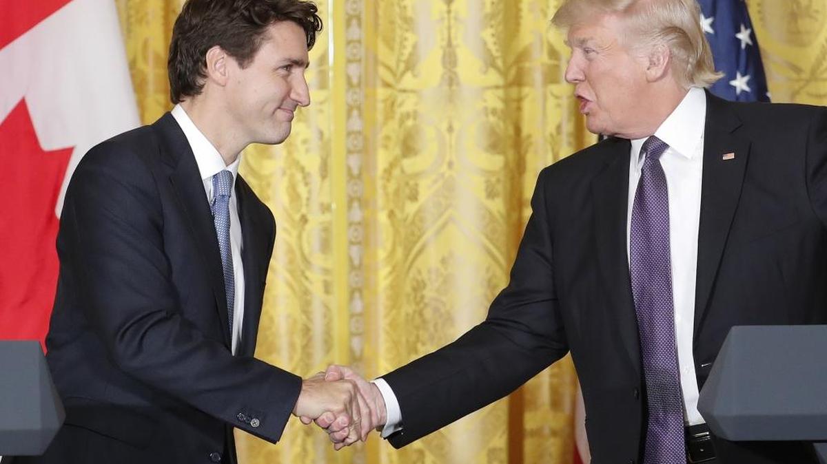 President Donald Trump and Canadian Prime Minister Justin Trudeau shake hands during a joint news conference in the East Room of the White House in Washington on Feb. 13.