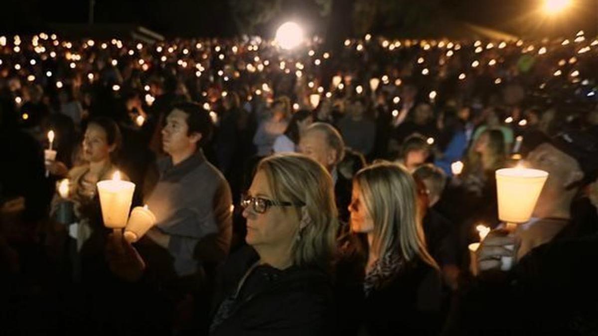 Community members gather for a candlelight vigil for those killed in a shooting at Umpqua Community College in Roseburg, Ore. on Oct. 1, 2015.