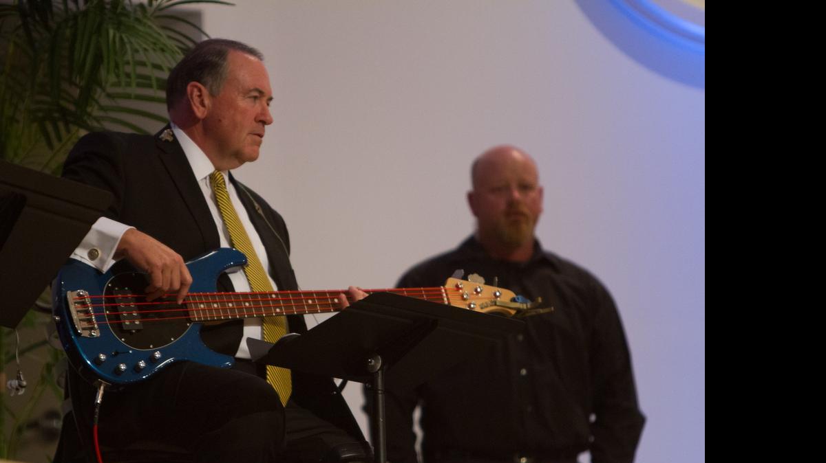 
Former Arkansas Governor Mike Huckabee plays bass during a stop at Langston Baptist Church in Conway.
