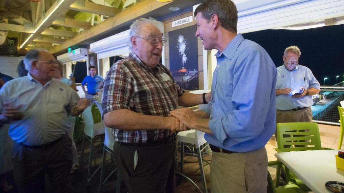 Luke Rankin greets supporter John Bonsignor after the winning re-election to his seat Tuesday night.
