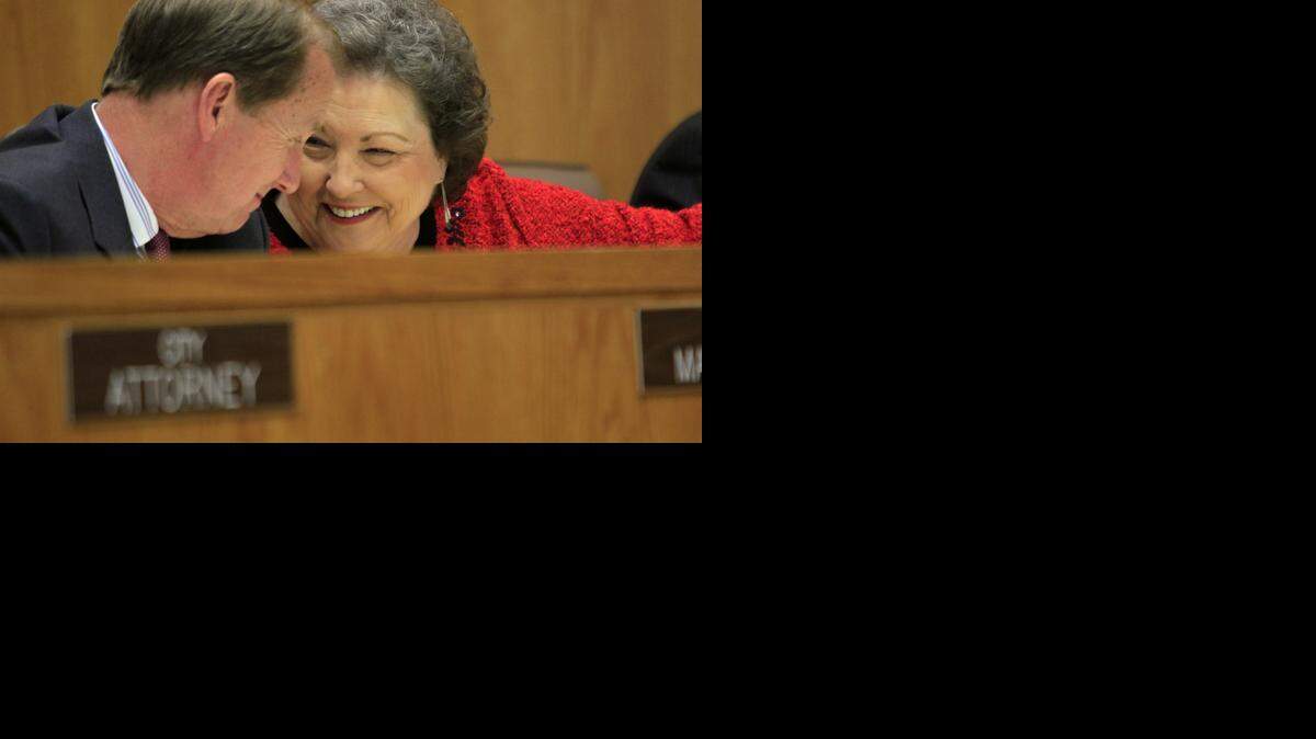 
Myrtle Beach City Council members Susan Grissom Means (right) talks to now-retired City Manager Tom Leath a council meeting. 
