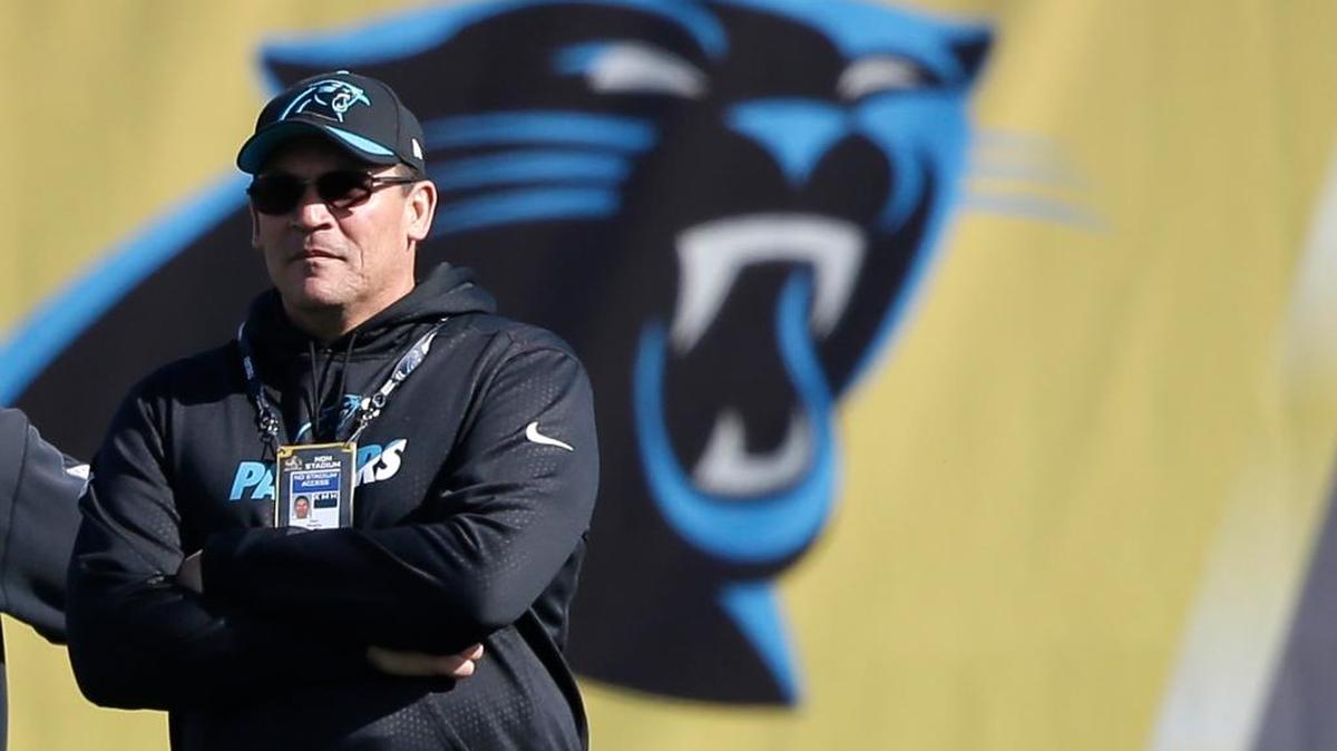 Panthers head coach Ron Rivera watches his team stretch during Friday’s practice.