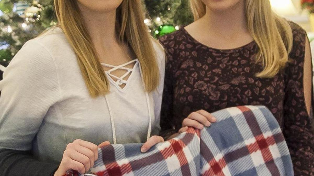 Regan (left) and Renea Urbaniak present a dozen blankets they made to residents of Summit Place Senior Living on Wednesday, Dec. 14, 2016. The twins from the Academy of Arts, Sciences & Technology made the blankets as part of their National Honors Society community service. They were nominated for Horry’s Angels by their mother, Sharon, who wrote: “They were striving to help children in need, so they thought keeping them warm would be a great option. Renea and Regan purchased fleece throw blankets and doubled them up to make tie-knot blankets. They wanted to give to the less fortunate children at Ocean Drive Elementary School in North Myrtle Beach, ensuring the young kids would have a blanket to keep warm... This is a selfless act because it takes a lot of time to assemble these blankets, helping kids know they can have access to a blanket creating a positive atmosphere to feel safe and warm. The girls give back to society, and help allow students to perform efficiently in education, by not having to worry about being cold or without a blanket at night.”