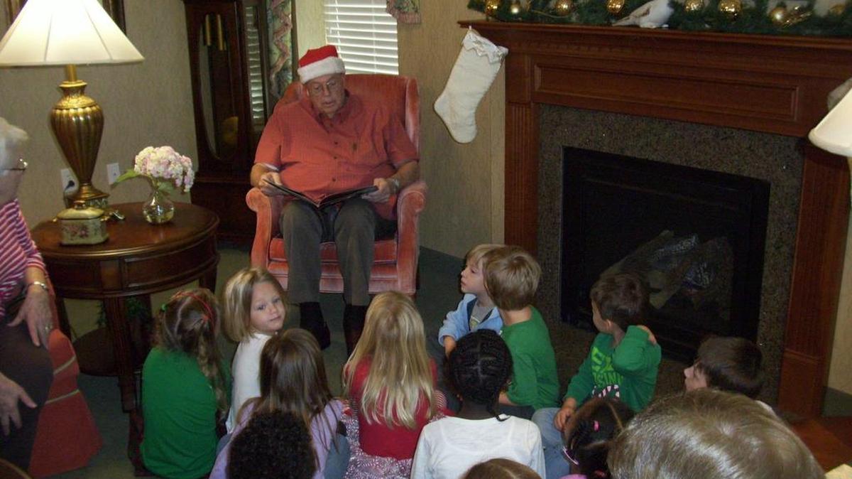 Barney Brueck of the Brightwater community in Surfside Beach reads ‘Twas the Night Before Christmas to students of Gateway Academy recently. The two groups have been meeting monthly to allow seniors and children to interact.