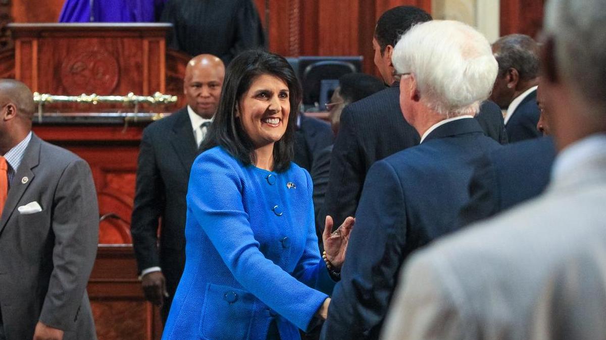 Gov. Nikki Haley greets the legislators as she leaves the chambers of the South Carolina House of Representatives Wednesday night after her State of the State address.