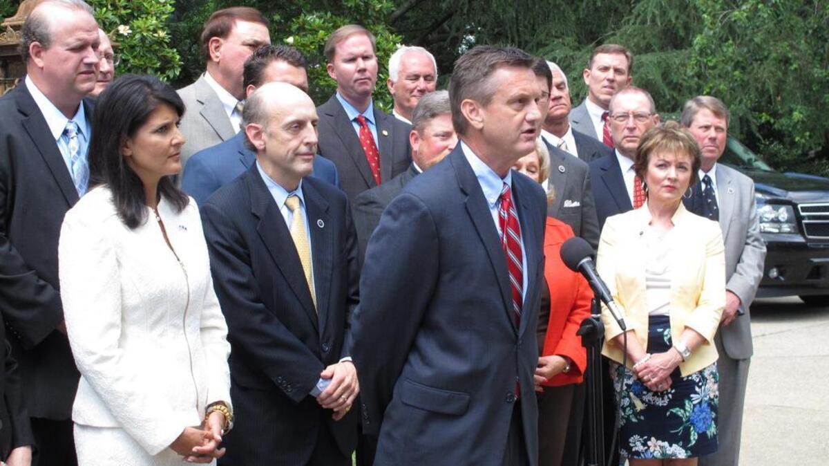 South Carolina Sen. Tom Davis, R-Beaufort, speaks about his filibuster of plans on how to spend extra money in the South Carolina budget during a news conference called by Gov. Nikki Haley on Tuesday, May 26, 2015, in Columbia, S.C. Haley said the Legislature needs to give a tax cut, pay off debt or fix the state's roads and bridges with the extra revenue. (AP Photo/Jeffrey Collins)