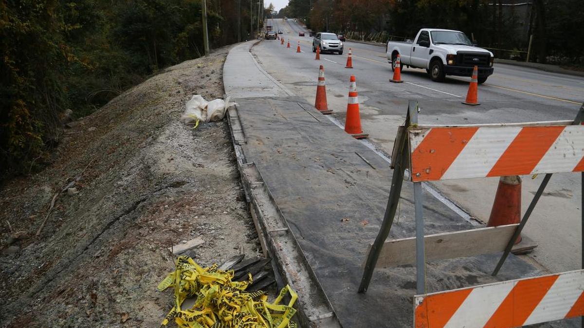 Beltline is repaired where floodwaters washed portions away. 12/1/15