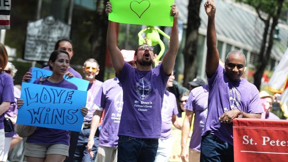 Members of St. Peter's Episcopal Church march during Charlotte's annual Gay Pride parade from 1 to 3 pm in uptown. More than 135 contingents were involved in the parade, including 3,300 people.