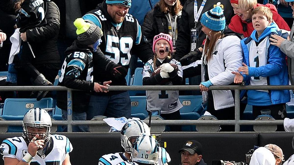 A stunned Isabella Bottomley, 8, reacts after Carolina Panthers running back Jonathan Stewart gave her the ball he’d carried into the end zone for the first touchdown against the Seattle Seahawks Sunday. See story on page 4A.