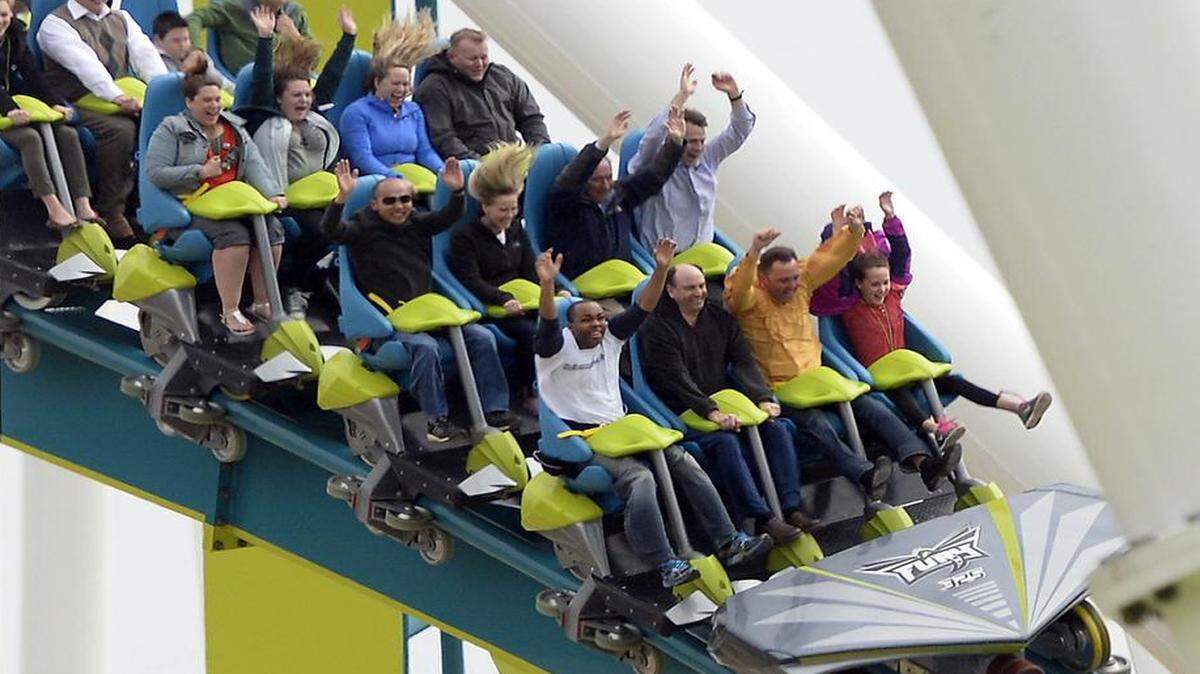 
Roller coaster riders enjoy their experience on Carowinds' new Fury 325, the world tallest and fastest giga coaster, during media day on Wednesday, March 25, 2015.
