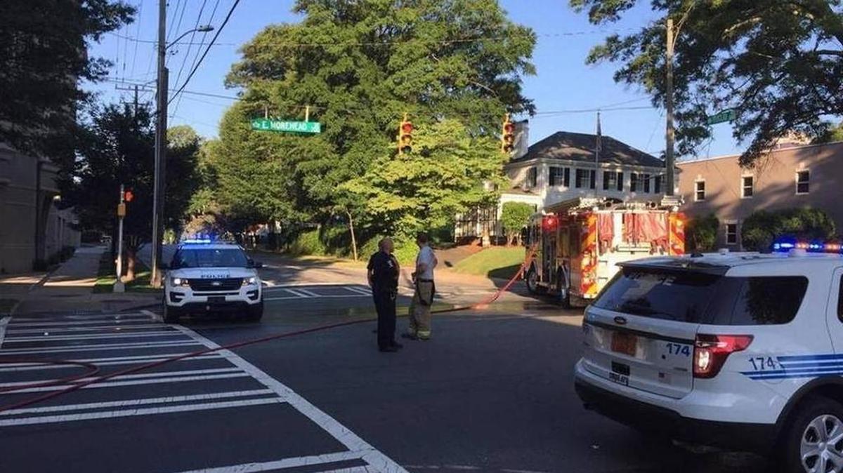 Police and firefighters respond to the intersection of Morehead Street at Euclid Avenue, where an officer struck and killed a pedestrian Saturday.