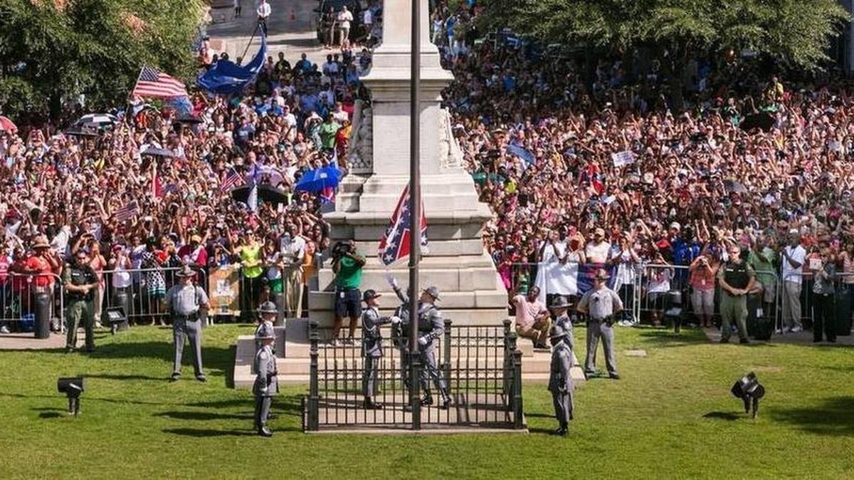 FILE PHOTO: S.C. Highway Patrol Honor Guard members take down the Confederate battle flag from the State House grounds for the final time during a ceremony on July 10.