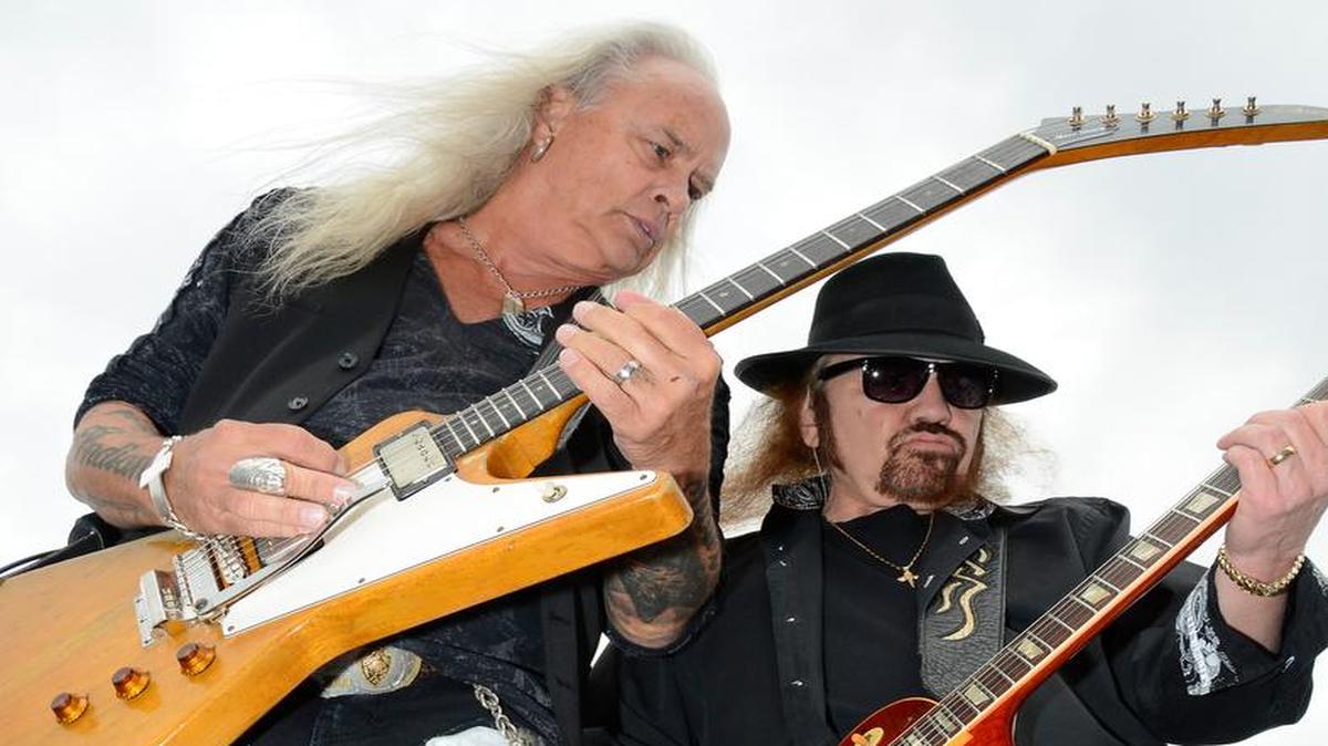 Lynyrd Skynyrd band members Rickey Medlocke, left, and Dale Rossington perform before the NASCAR Sprint Cup Series auto race at Texas Motor Speedway in Fort Worth, Texas, Saturday, April 9, 2016.