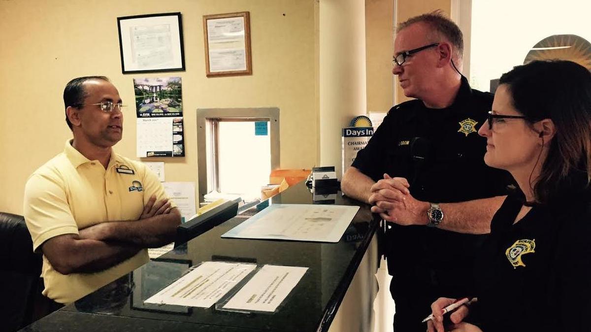 Vishal Sagdeo, general manager of the Days Inn on Bush River Road, speaks with Capt. Joe Odom, center, and Capt. Heidi Jackson, right. The Richland County Sheriff’s Department has started working with motels and hotels to educate employees on how to recognize sex trafficking in their establishments.
