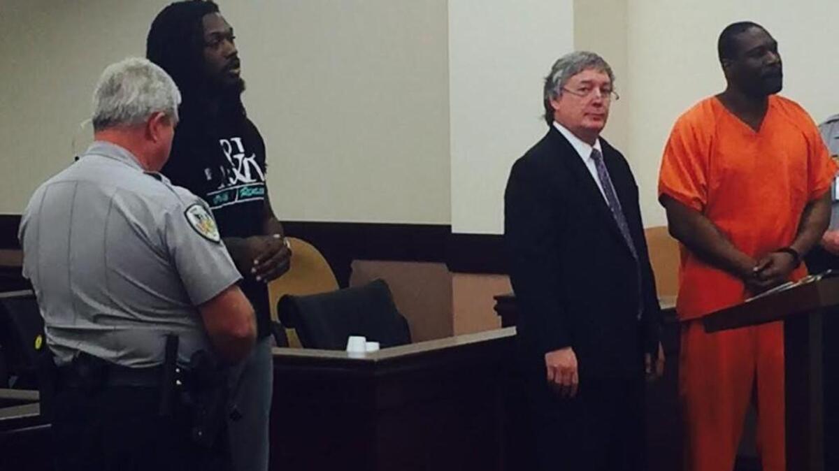 NFL player Jadeveon Clowney, left, appeared at a Thursday hearing to request bond for his father, David “Chilli Bean” Morgan, who is charged with shooting at two people at a Rock Hill strip club last August. Morgan, far right, was accompanied by his attorney, Michael Brown Jr., center.
