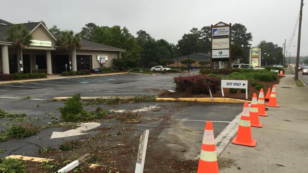 The entrance to the South Carolina Federal Credit Union is closed off Thursday, May 19, 2016, as investigators collect evidence after a police chase ended there. A suspect being pursued by a Forest Acres officer wrecked into an ATM there, according to the S.C. State Law Enforcement Division. The chase began after the officer shot the suspect, who had tried to strike him with his car, according to a SLED spokesman.