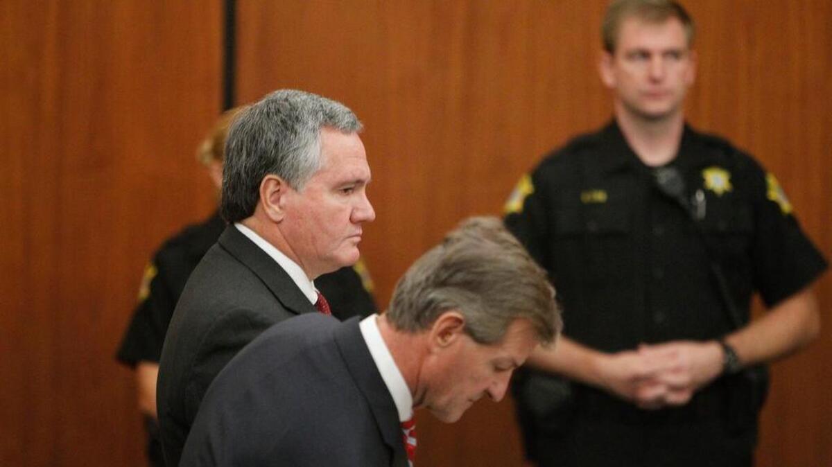 
Bobby Harrell, former speaker of the S.C. House, stands with his lawyer Bart Daniel as he pleads guilty to six counts of misusing campaign funds in October 2014.
