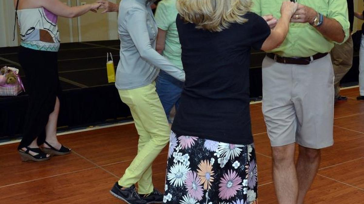 
Married couple Wayne and Cheryl Dodgen of Irmo try shagging after learning the basic moves.
