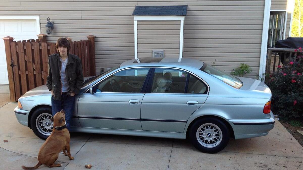 Anthony Ferrigno with his BMW and dog Logan