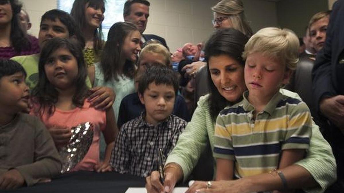 Gov. Nikki Haley signs an abortion bill at Hidden Treasure Christian School in Taylors Wednesday.