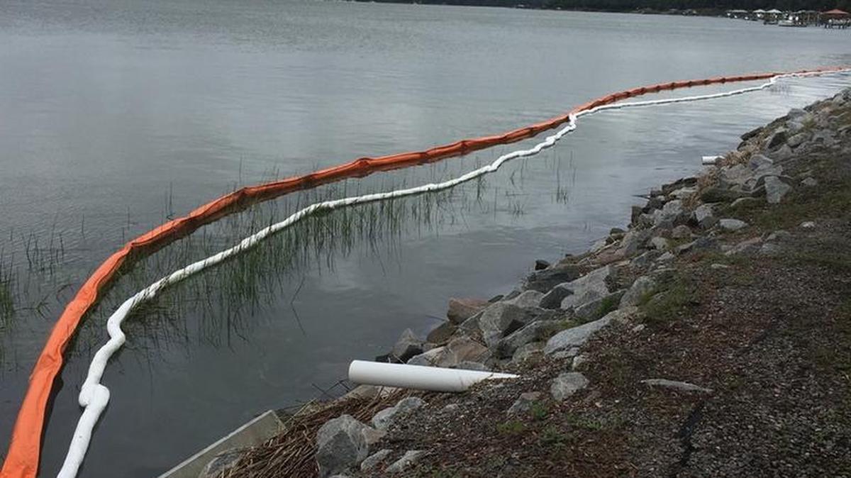 Booms are in place to contain oil found in the water behind Beaufort Memorial Hospital. The leak is believed related to the leak of hundreds of gallons of heating fuel oil into the hospital’s boiler room May 23.