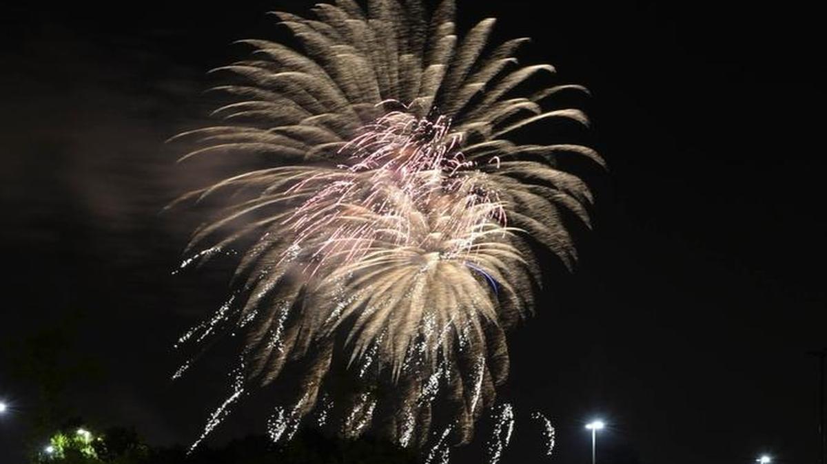 Spectators watch Sunday’s fireworks show at Carowinds. Monday’s show started 20 minutes early, annoying latecomers.