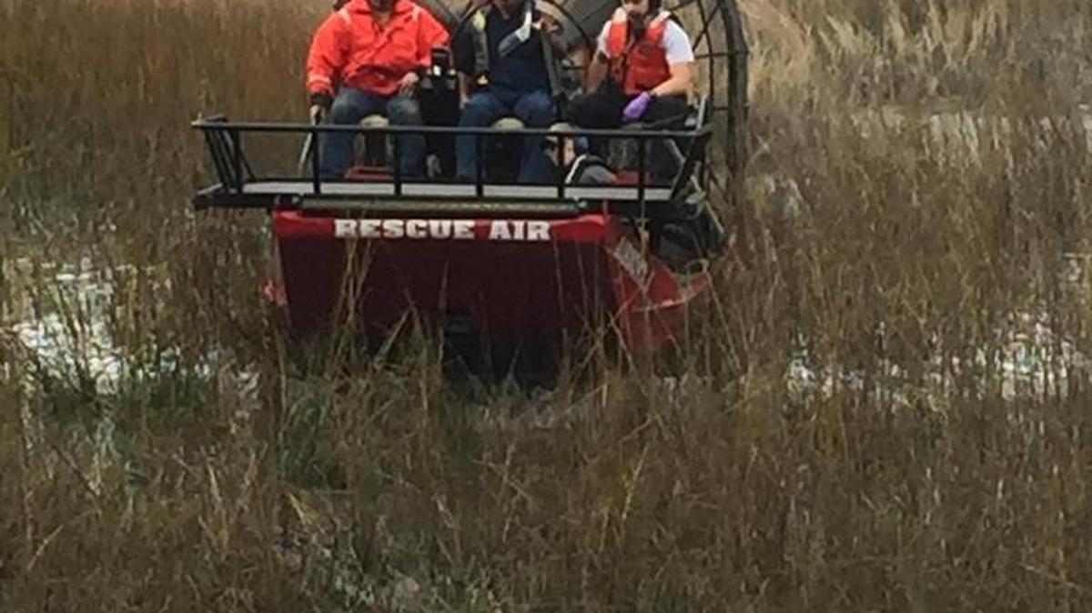 Members of the Beaufort Water Search and Rescue service and a Beaufort/Port Royal firefighter rescue a man and his dog who had become stuck in pluff mud Jan. 16, 2017, off Sycamore Street, Beaufort.
