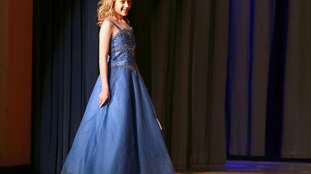 Hannah Collins walks out onto stage before winning Young Miss at Walterboro's annual Miss Rice Festival on April 9, 2016 at the Performing Arts Center at Colleton County High School. Collins, 11, died Friday night after contracting a deadly amoeba while swimming in the Edisto River in Charleston County, her family said.