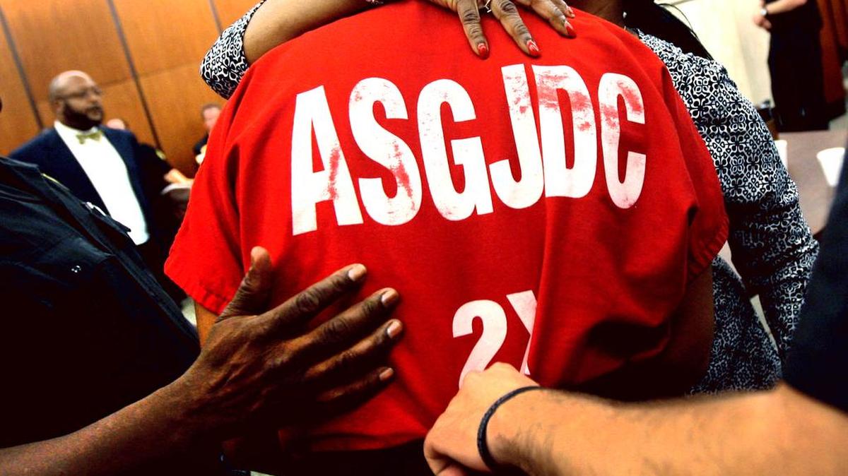 A 16-year-old son hugs his mother in Richland County Family Court before he is taken back into the custody of the state Department of Juvenile Justice.