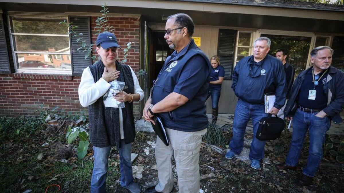 Kimberly Sonnenfeld walks through the gutted house she lived in during the flood. Rain and floodwaters ravaged the Columbia area in early October, and FEMA responded to tens of thousands of residents who were displaced because of the damage.
