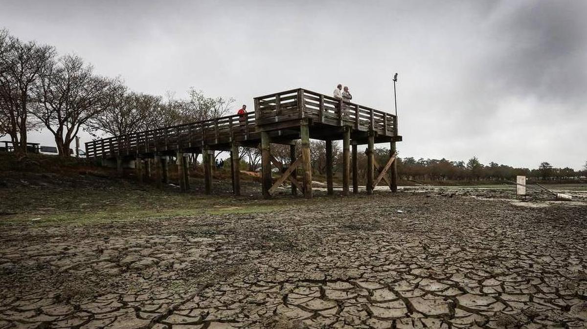 Dry lakebed after U.S. Army dam at Fort Jackson blew out last fall during historic rain and flood in Columbia